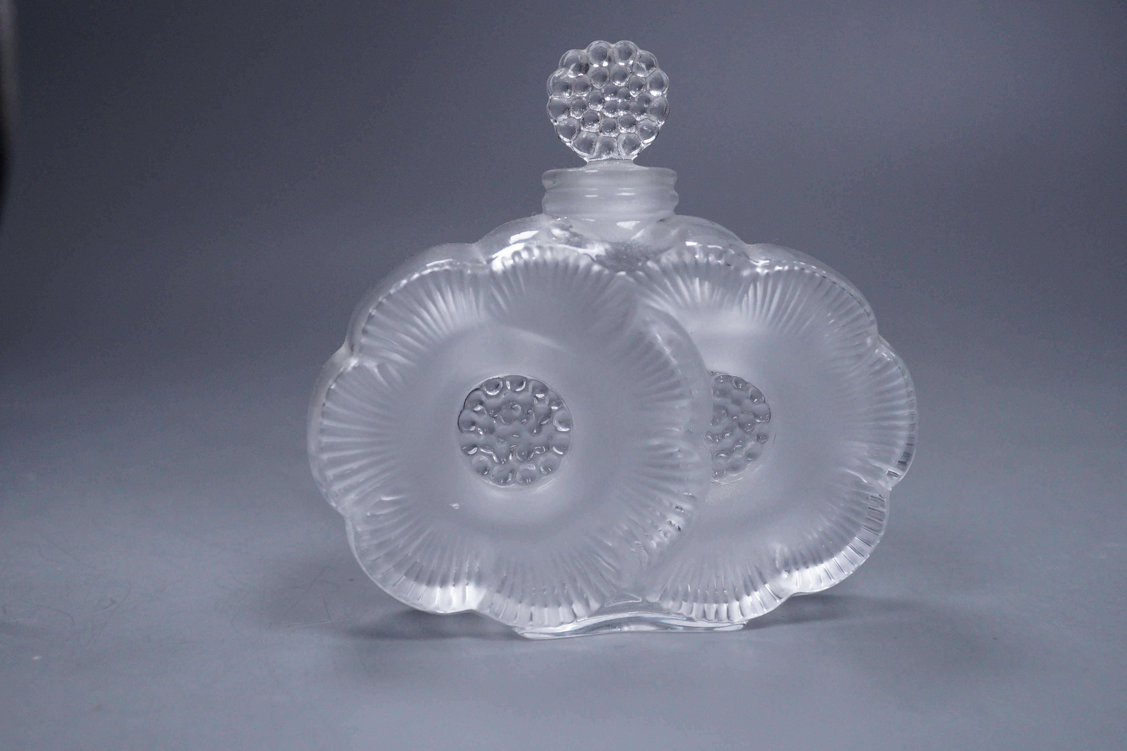 A Lalique Deux Fleurs scent bottle with stopper, 9cm tall
